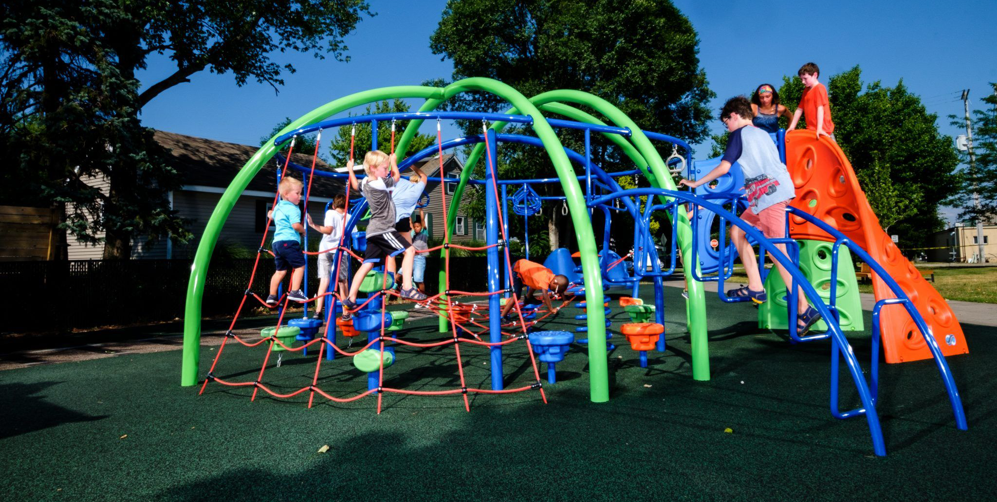 Children climbing on NRG playground equipment
