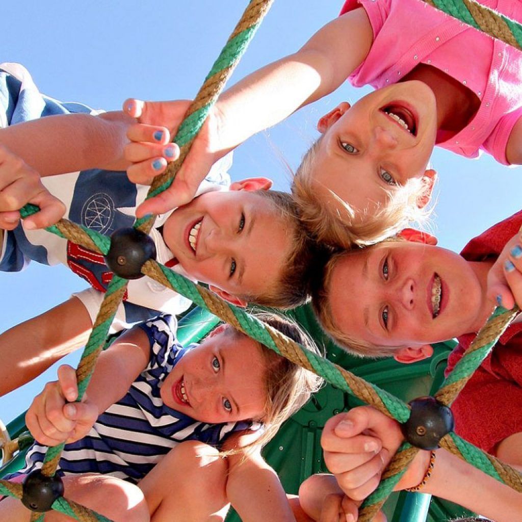 Children playing on a rope structure.