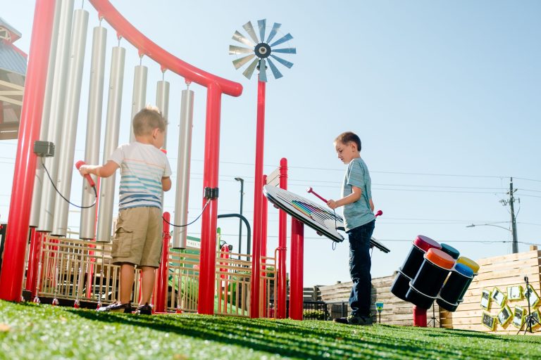 kids playing with playground instruments