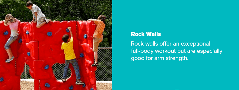 children climbing rock wall