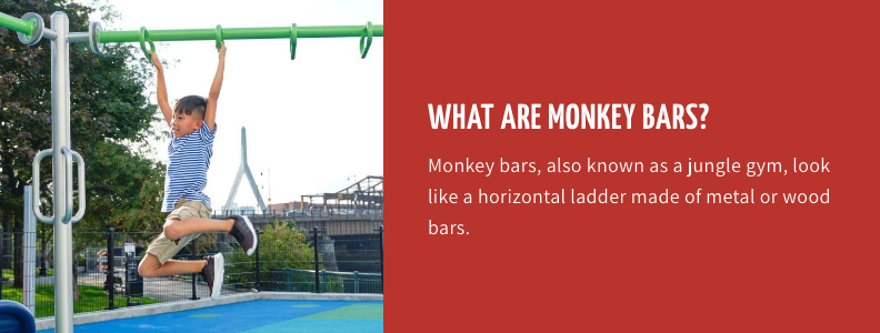 Little boy swinging on monkey bars